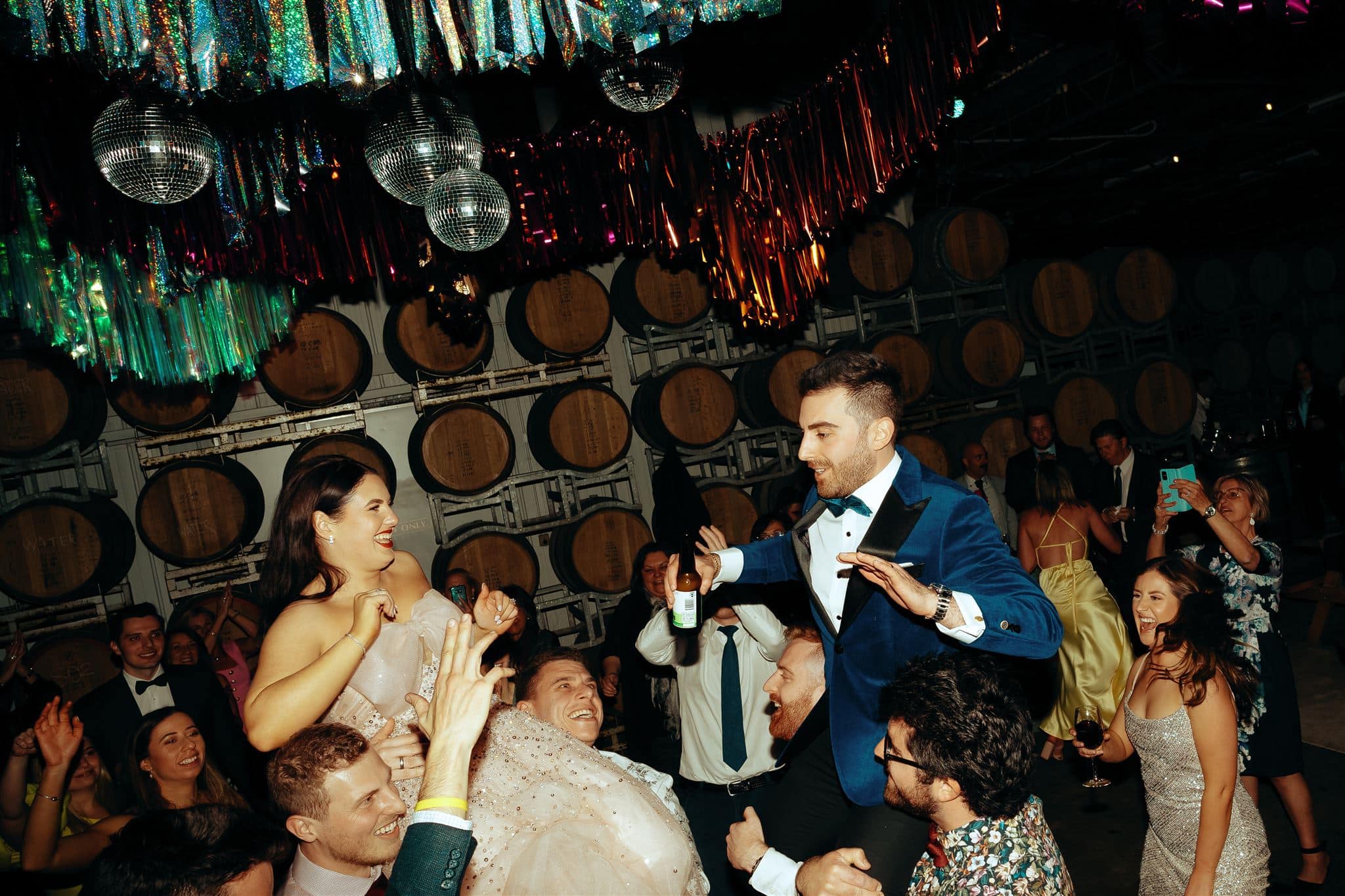 Fun Disco Themed Wedding with Wine Barrels Photographed by Jackson Grant